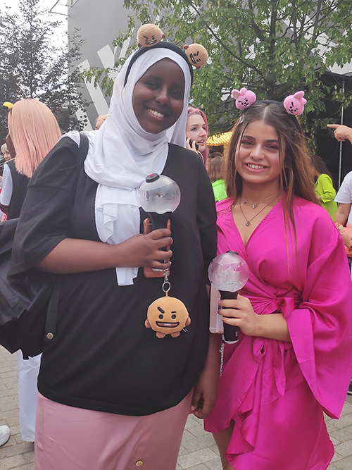 Gareena, 18, (London) and Filsan, 17 (Bristol). These two met on Twitter and their shared love for BTS brought them to the concert in London. Though their styles are considerably different, they both incorporated pink in their outfits, probably because of the #WembleyTurnsPinkForBTS tag on Twitter.